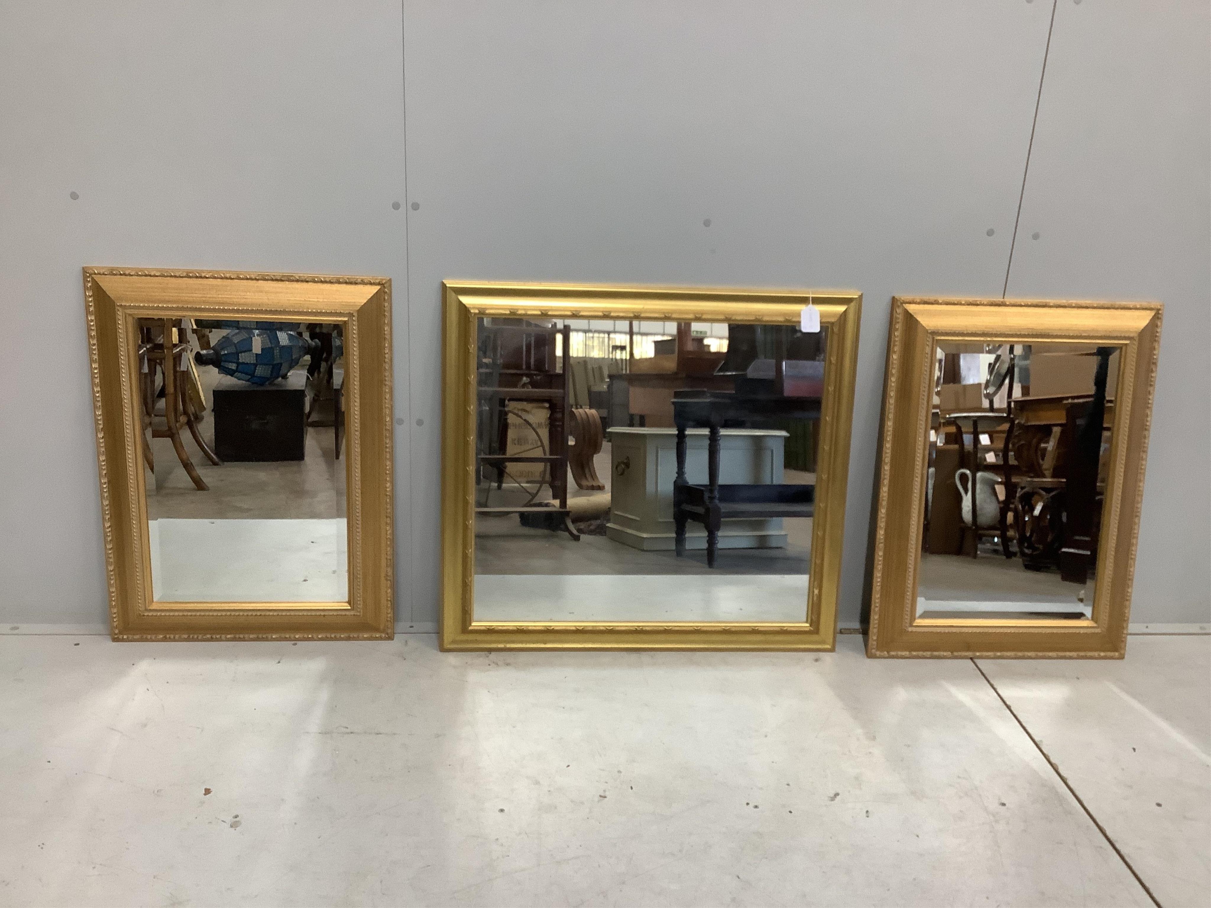 Three modern rectangular gilt wall mirrors, largest width 84cm, height 78cm. Condition - good